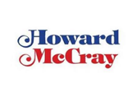 Logo of howard mccray with stylized text in blue and red colors.